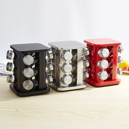 Spice rack kitchen with glass seasoning jars and stainless steel holder on a counter.